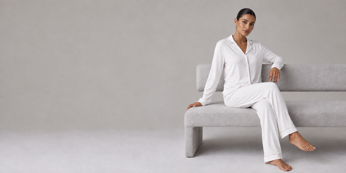 COMFI white modal sleepwear on a seated model